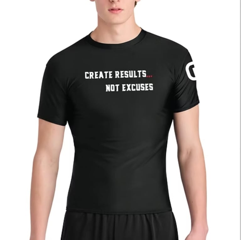 Black athletic t-shirt with white text reading CREATE RESULTS NOT EXCUSES worn by a man against white background